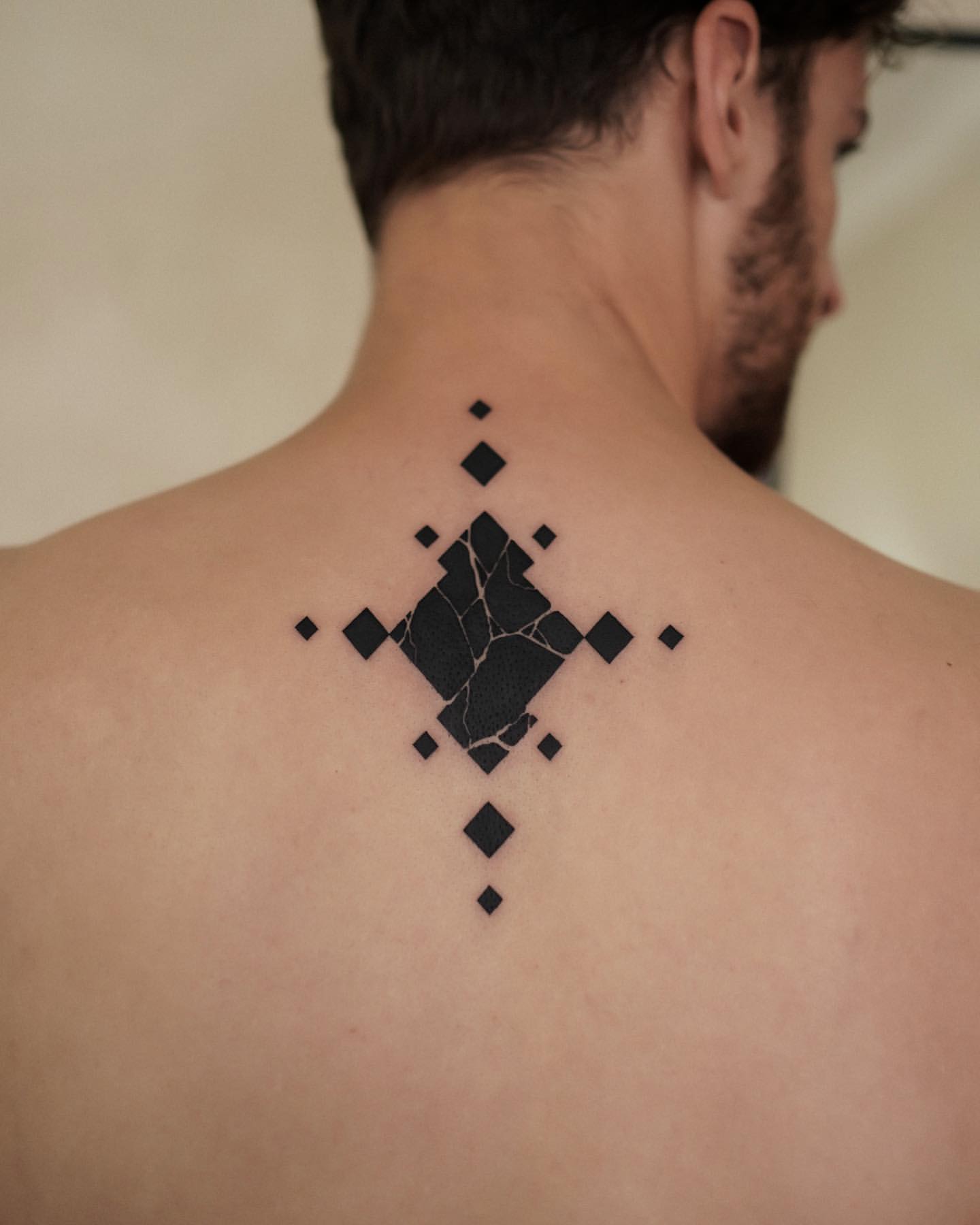 small tattoos for men on back 0020