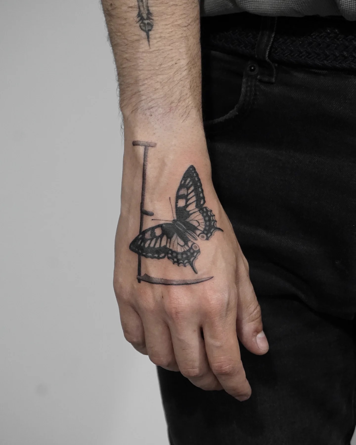 small tattoos for men on hand symbolism