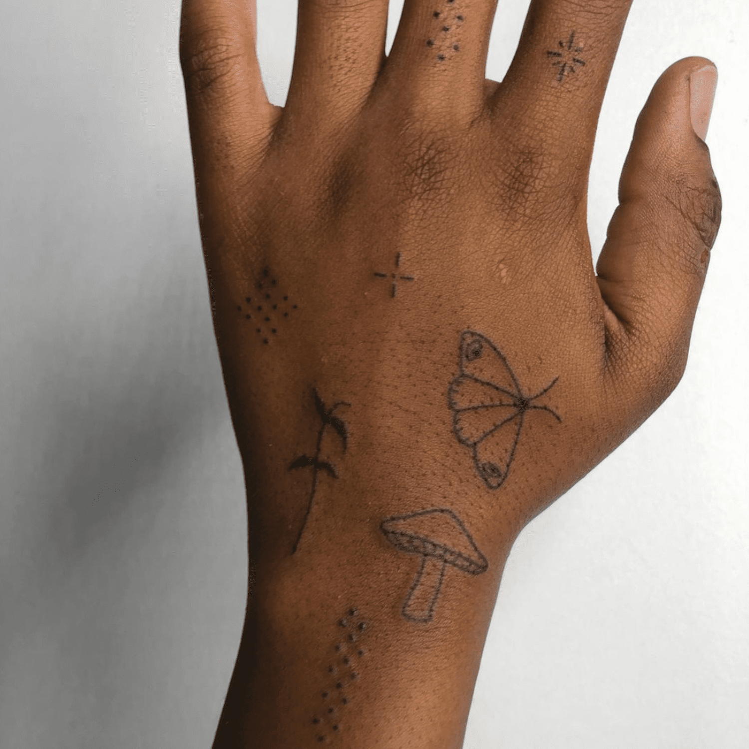 small tattoos for men on hand 0086