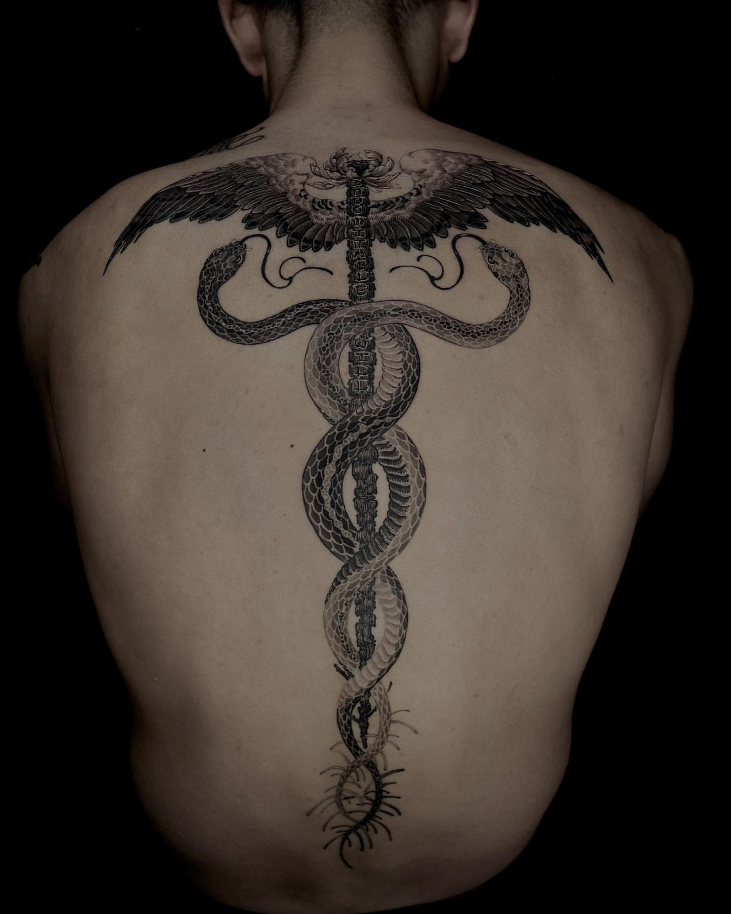 spine tattoos for men designs