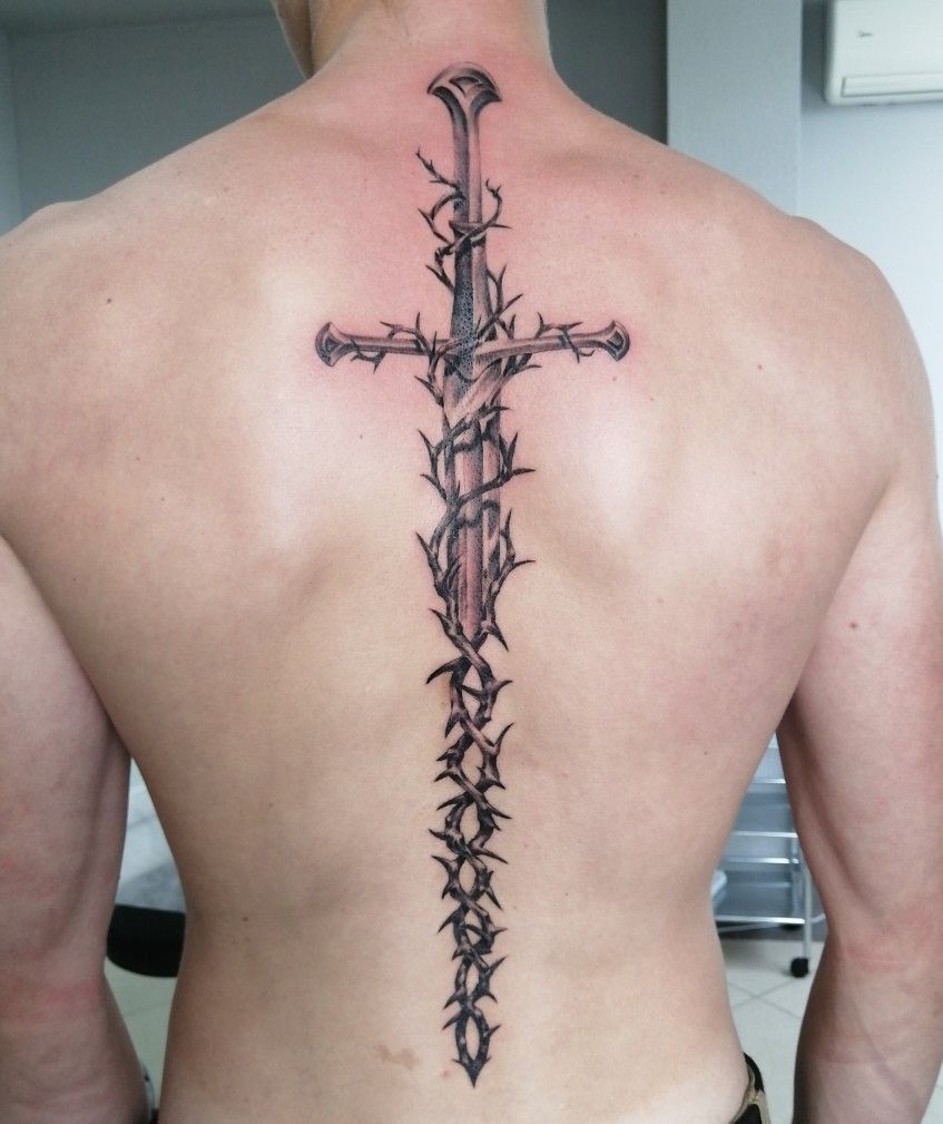 sword-themed back tattoos for men