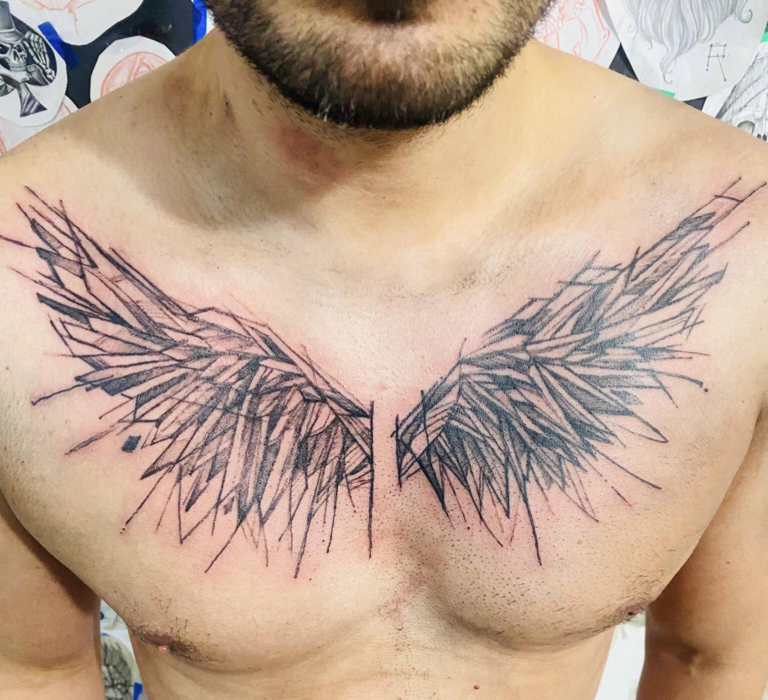 symbolic chest tattoos for men with wings