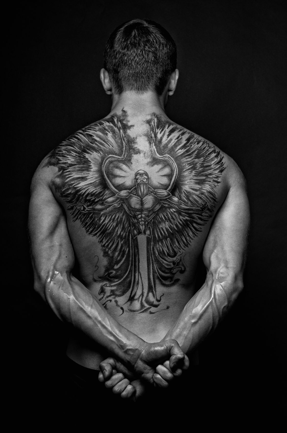 symbolism of angel back tattoos for men