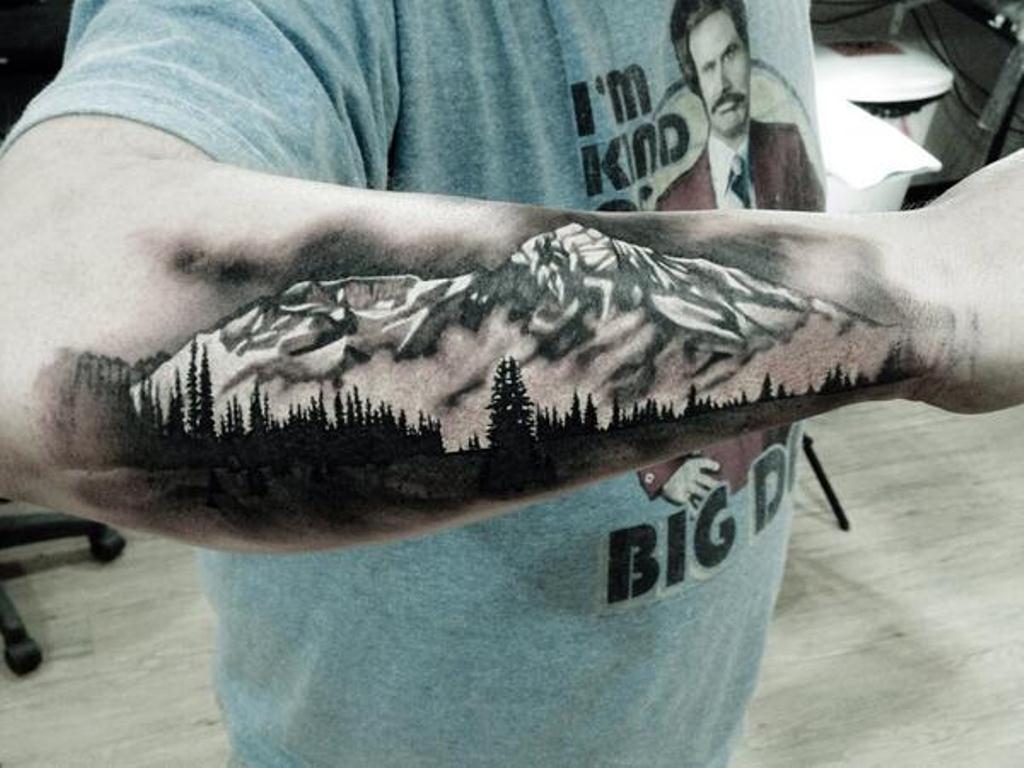 tribal mountain tattoos for men