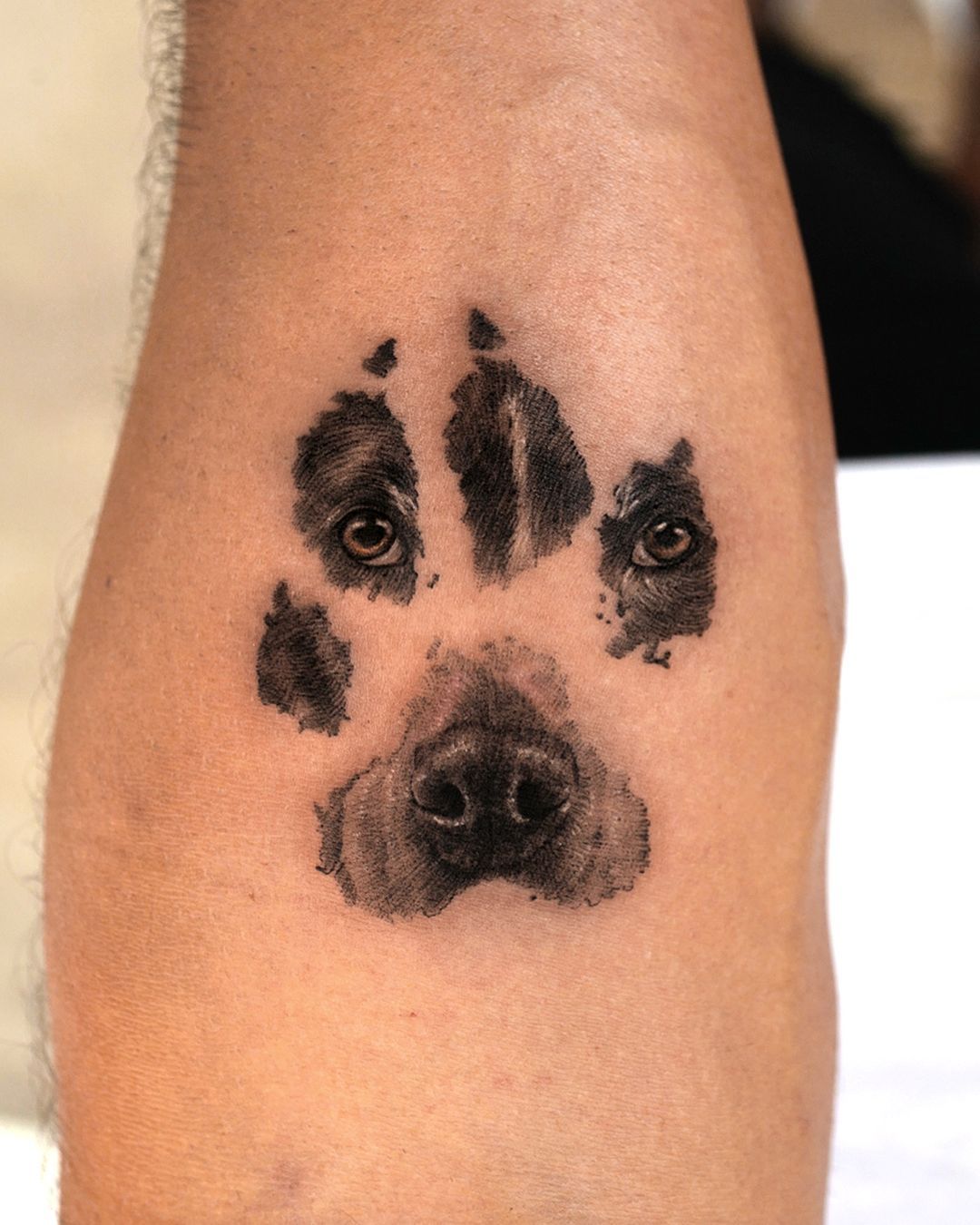 tribal paw print tattoos for men.