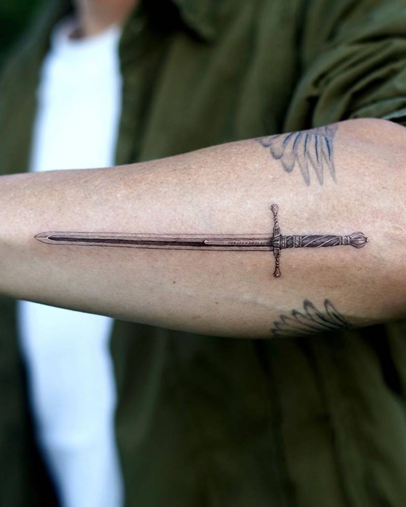 tribal sword tattoos for men