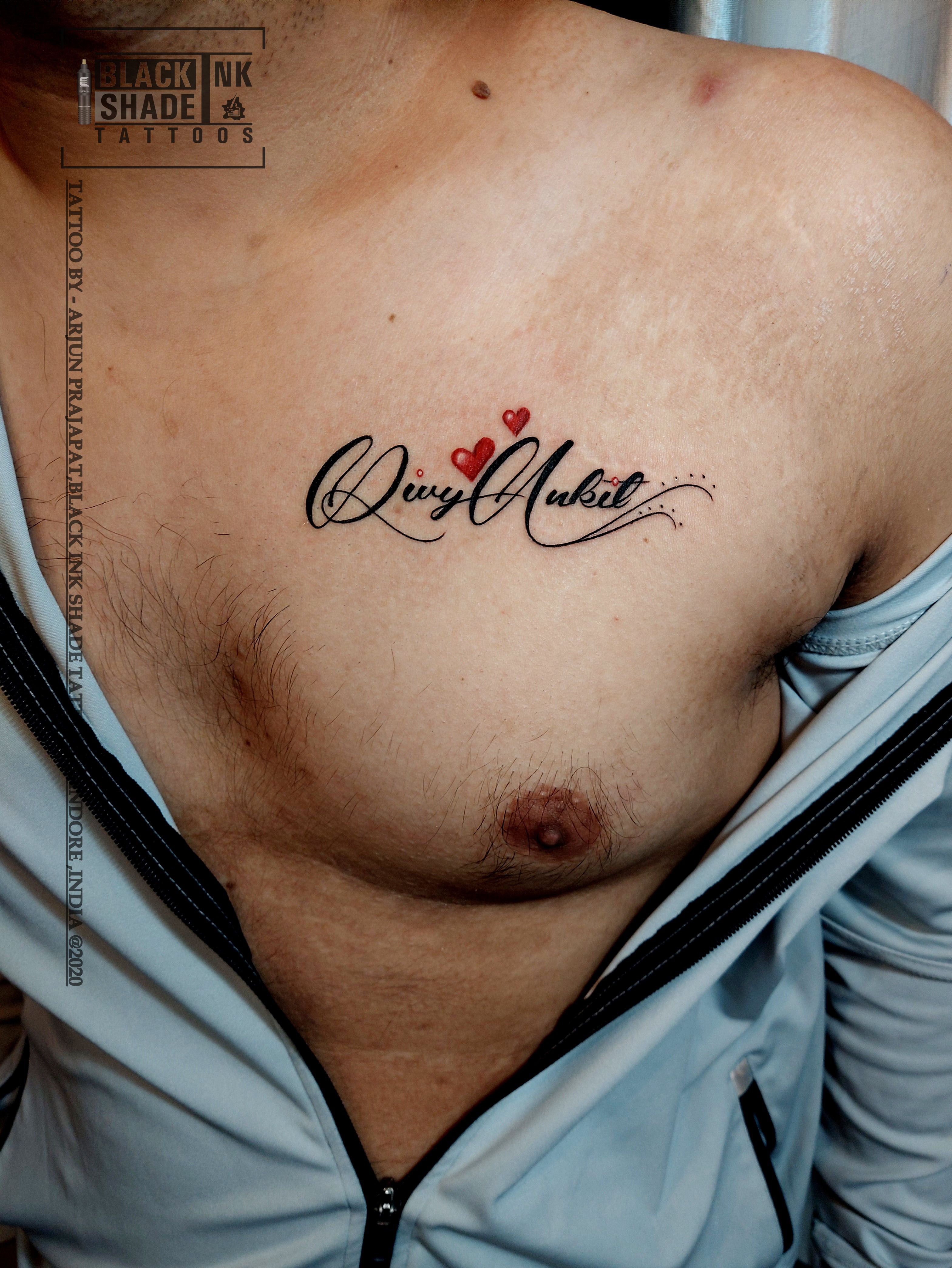 unique chest name tattoos for men