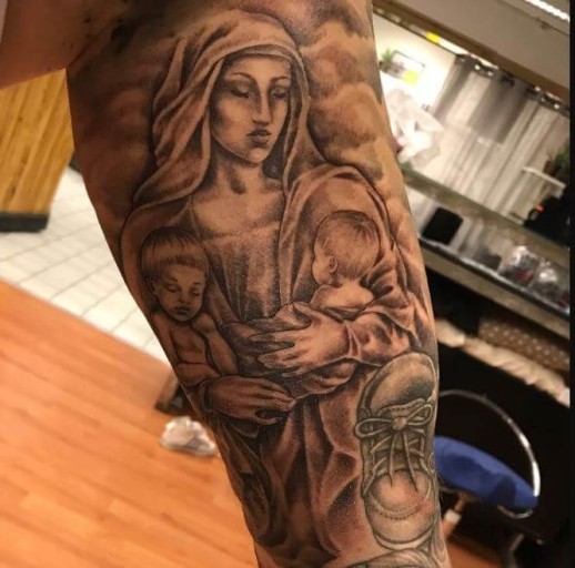 unique Christian thigh tattoos for men