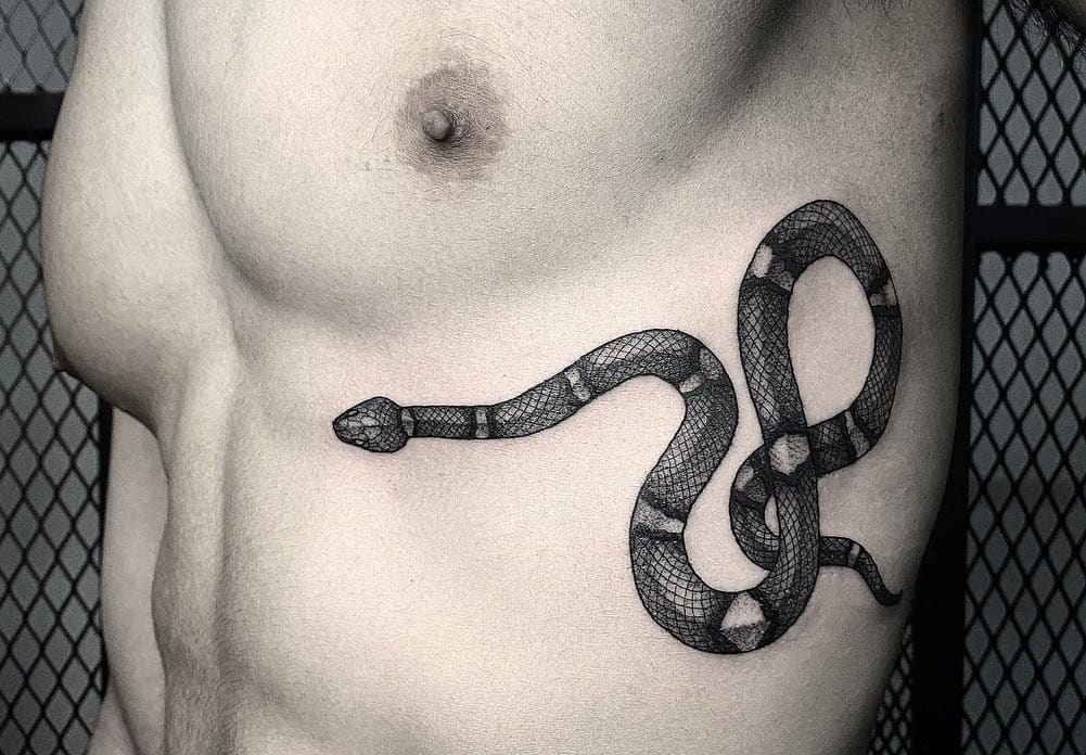 unique designs for snake tattoos for men