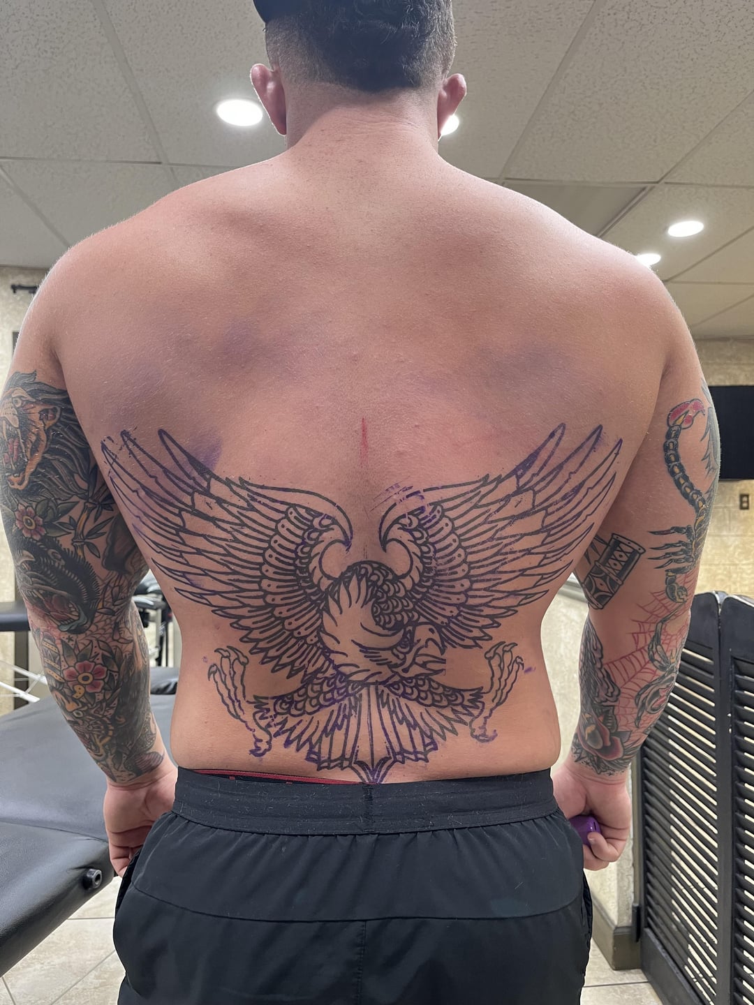 unique designs for upper back tattoos for men