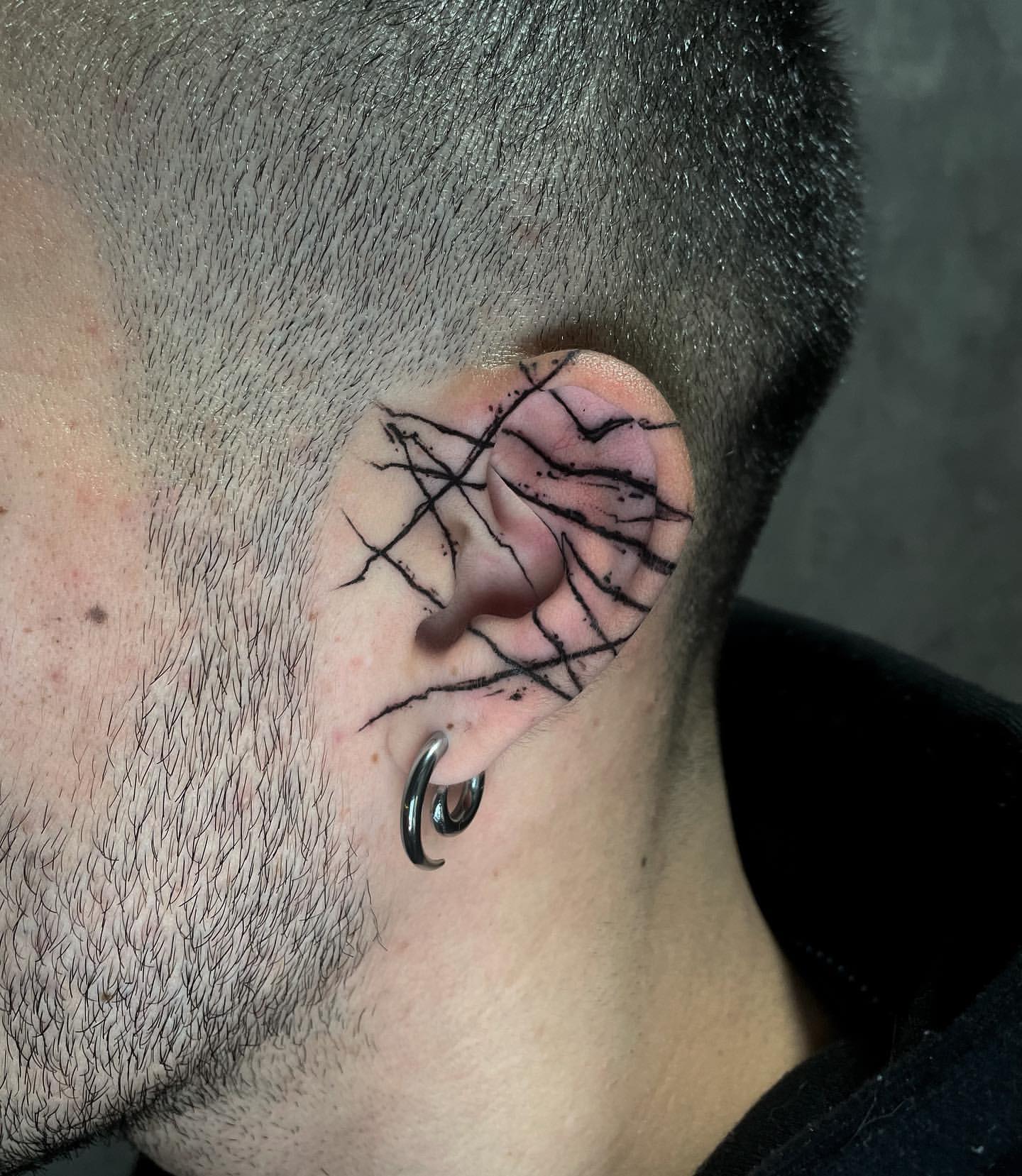 unique ear tattoos for men ideas