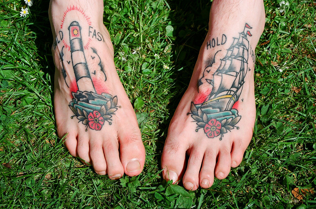 unique foot tattoos for men themes