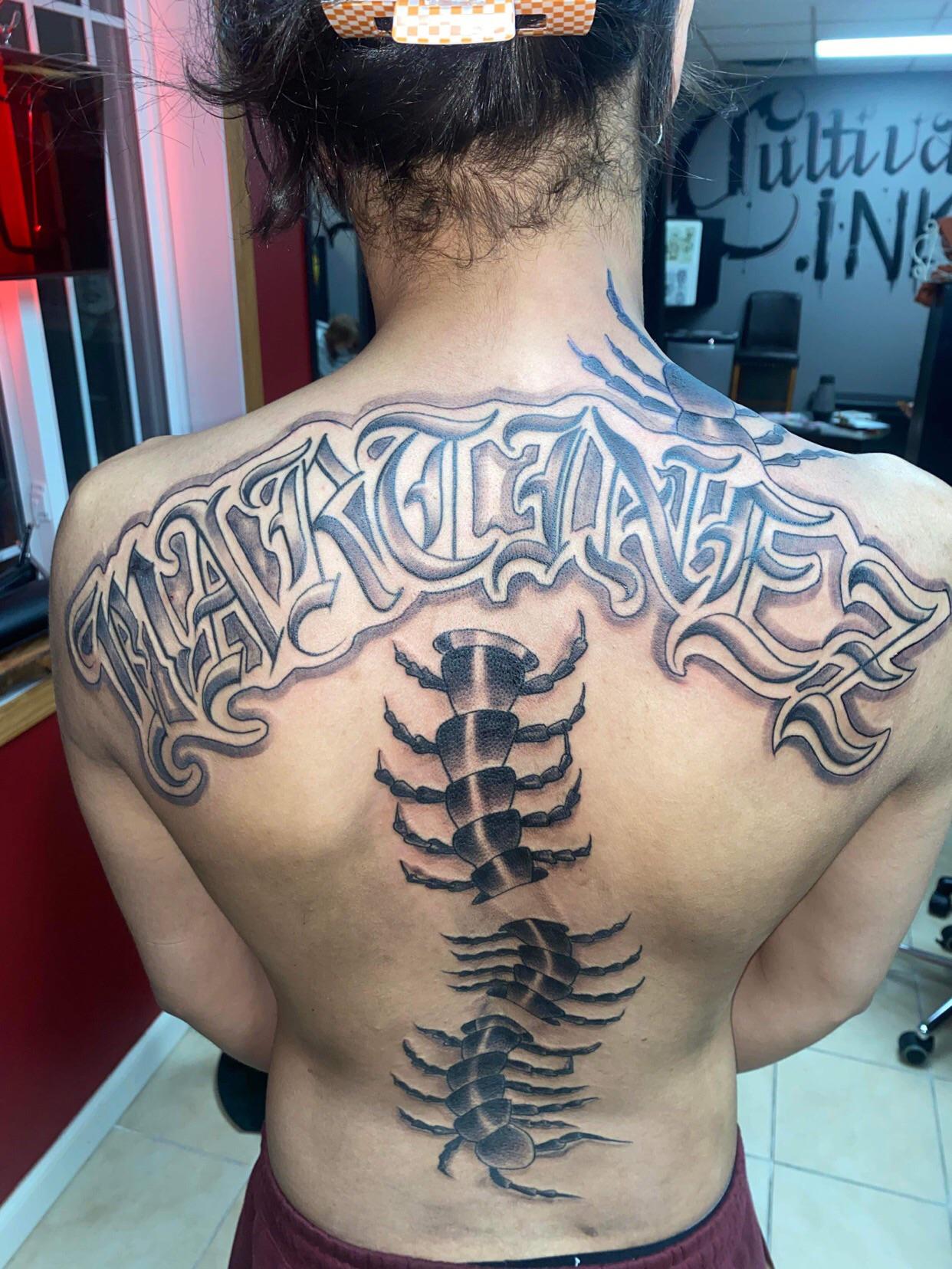 unique last name back tattoos for men