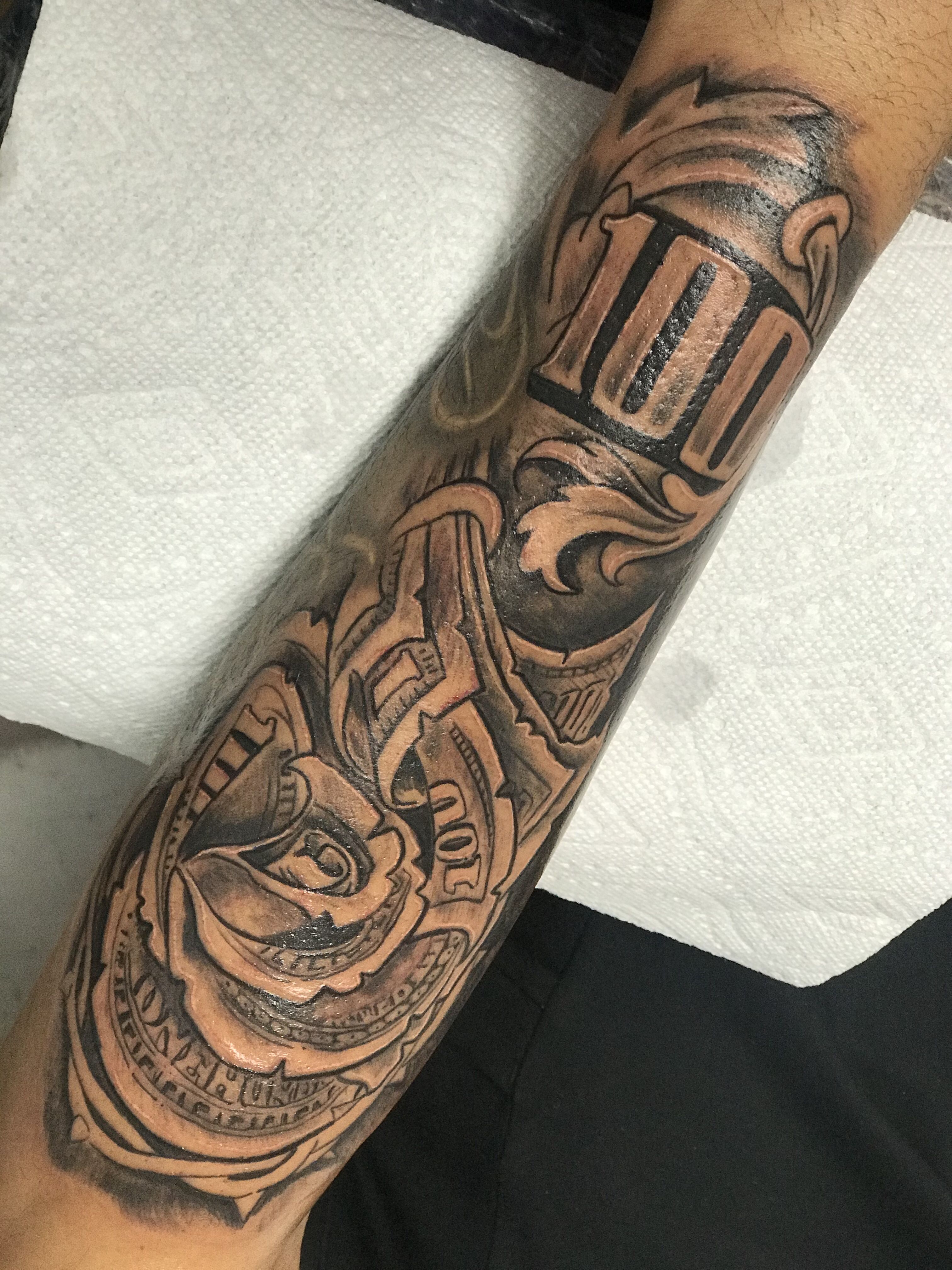 unique money outer forearm tattoos for men