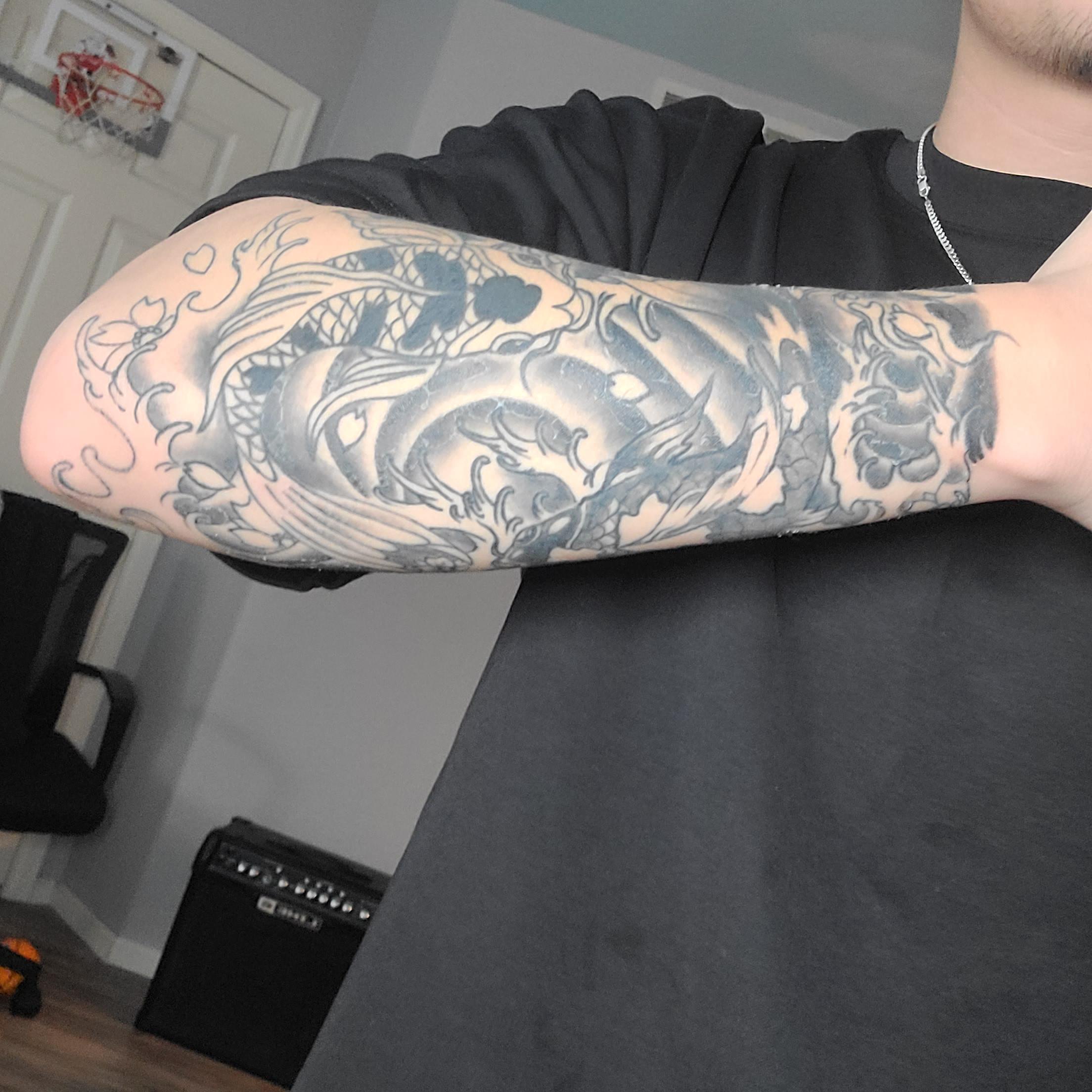 upper arm tattoos for men 0037