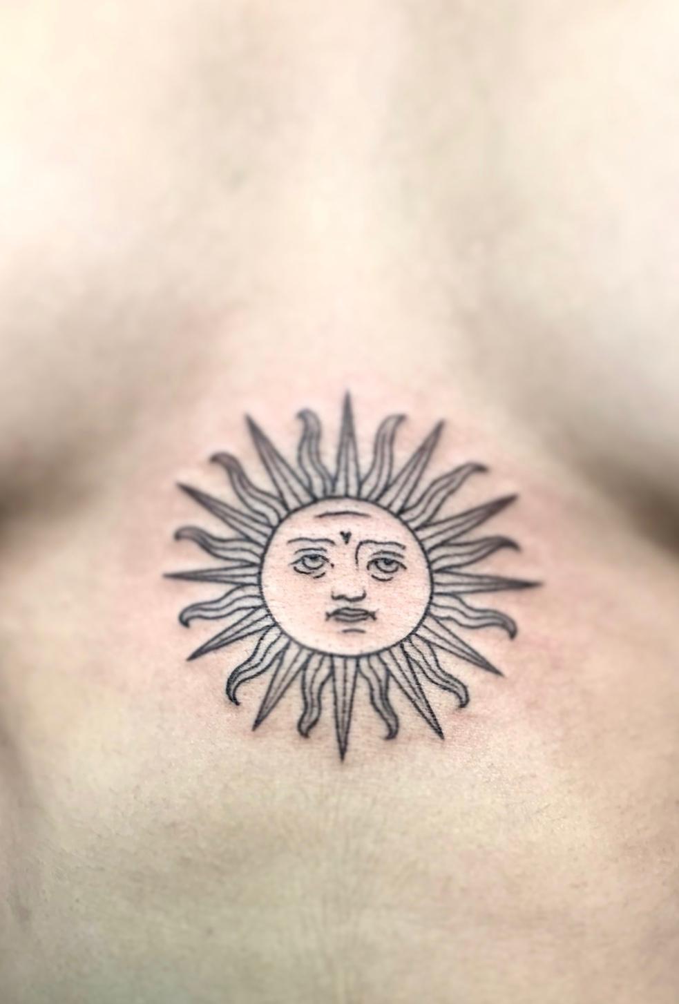 Traditional sun tattoos for men that symbolize strength and vitality