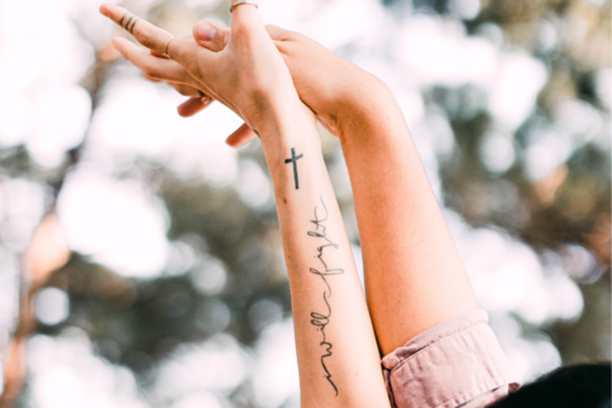 Wrist Cross tattoos for men that symbolize faith and strength perfectly